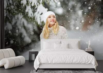 Young woman winter portrait. Expressing positivity, true brightful emotions. Beautiful blond hair girl i winter clothes Wall mural