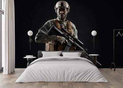 African male soldier wearing army uniform holding weapon. Wall mural