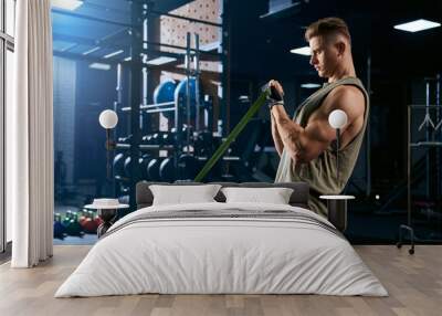 Bodybuilder training arm with resistance band. Wall mural