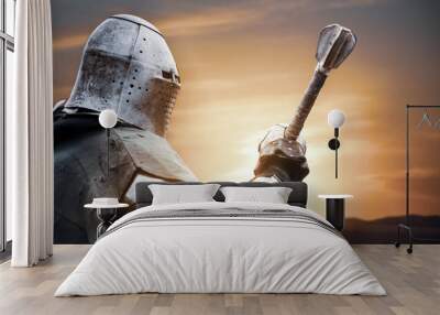 Medieval knight posing with sword. Wall mural