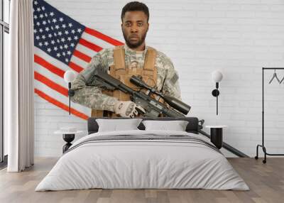 Serious American soldier with modern weapon. Wall mural