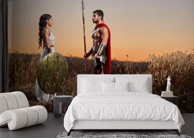 Spartan warrior and his woman in the field Wall mural