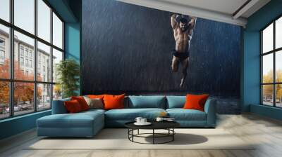 Wet shirtless gladiator jumping in attack. Wall mural