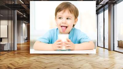 Cute little boy with a glass of milk Wall mural