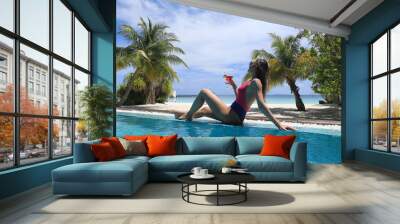 girl in bikini with cocktail in tropical pool Wall mural