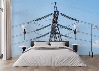 High-voltage tower on blue sky background. Wall mural