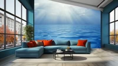 Solar beams above a quiet surface of ocean Wall mural