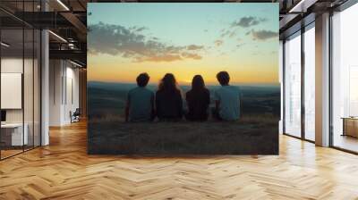 Three teenagers sit together on a hilltop, watching the sun dip below the horizon. They share laughter and conversation, surrounded by the beauty of soft sky colors in the warm evening light, creating Wall mural