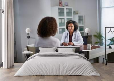 African American doctor consults an elderly patient. Medical consultation. AI generated. Wall mural