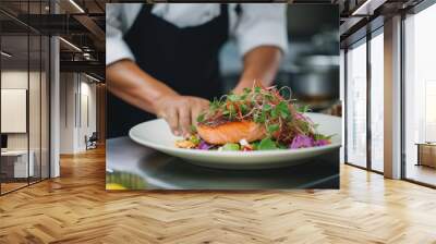 The chef decorates the fish steak with microgreen grass. Wall mural