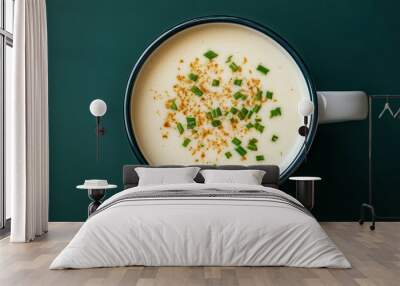 A cup of scallion latte, viewed from above. Wall mural