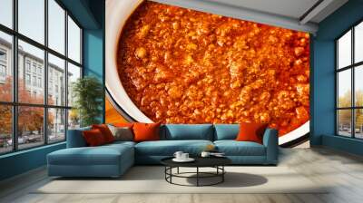 Close-up of fresh BOLOGNESE SAUCE in a white saucepan. High angle view. Wall mural