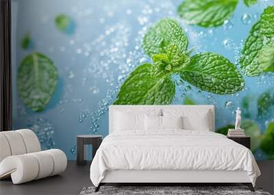 Mint leaves and water drops and bubbles on a blue background. Wall mural