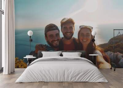 Happy smiling young people taking selfie against sea background, beach holiday with friends Wall mural