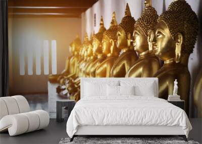 Ancient gold buddha statue in thailand temple corridor museum with sun light in window. Wall mural