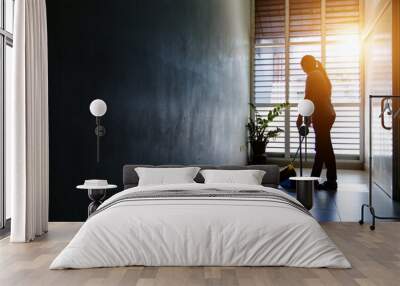 Janitor woman sweep the floor in hallway office building or walkway after school or classroom with blank copy space. Silhouette housekeeper working job with sun light background. Wall mural