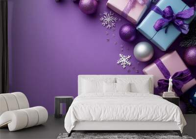 Convey your best wishes with this delightful gift arrangement. Top view of beautiful presents, celebratory balls, sparkling sequins, snowflakes on purple backdrop, designed for your personal message Wall mural