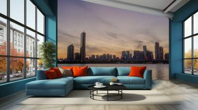 Sunset and silhouette view of 63 Building and high rise buildings of financial district with Wonhyo Bridge on Han River at Yeouido near Yeongdeungpo-gu, Seoul, South Korea Wall mural