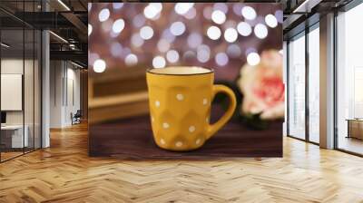 Coffee cup, tea, old books and rose on wood table in cafe with bokeh light background. Leisure lifestyle concept. Coffee on table in the night. Rustic background with beautiful  Wall mural