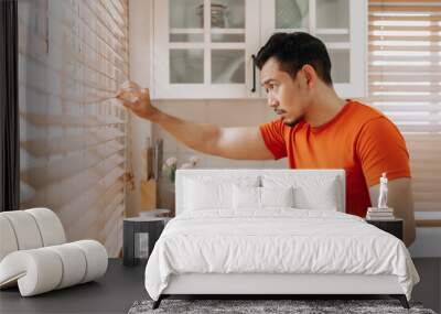 Asian man calm in the kitchen in the morning prepare his easy breakfast. Wall mural