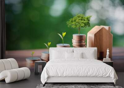 Piles of coins are placed on the wooden floor. The tree is growing on the coin. Financial growth concept, rising stock concept, investment concept. backdrop is a swaying tree bokeh. Wall mural