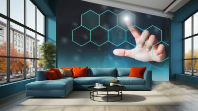 The man shows the gesture of pointing touching on the virtual screen and has a beehive screen effect.  Investment ideas, business concepts, technology concepts. Wall mural