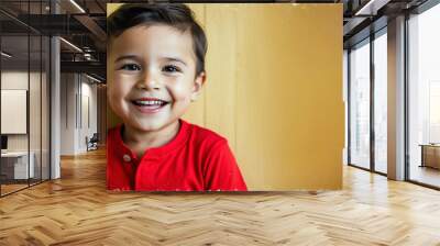 Little boy smiling in bright red shirt vintage summer concept background Wall mural