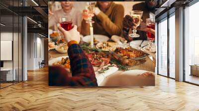 Close up of modern adult people raising glasses while enjoying Christmas dinner at home, copy space Wall mural