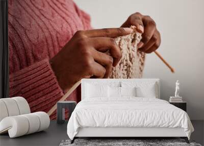 close up of unrecognizable african-american woman knitting scarf, copy space Wall mural