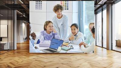 Diverse children smiling happily while enjoying group activity in math class Wall mural