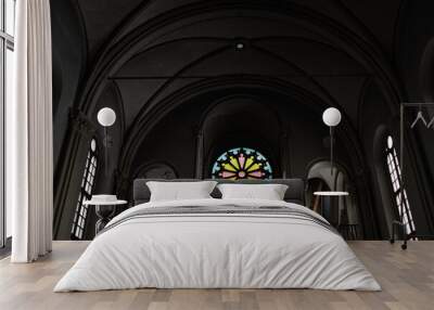 Low angle view of baptist church with dark walls and stained glass inside Wall mural