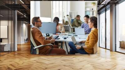 Male Business Manager Talking to Employee Wall mural