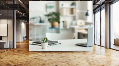 Minimal background image of inviting empty workplace with white desk and succulent plant in foreground, copy space Wall mural