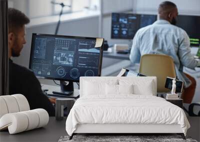 Portrait of male programmer or data specialist using computer in office with charts on screen, copy space Wall mural