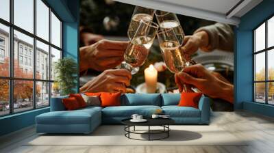 Vertical close up of four people enjoying Christmas dinner together and toasting with champagne glasses while sitting by elegant dining table with candles Wall mural