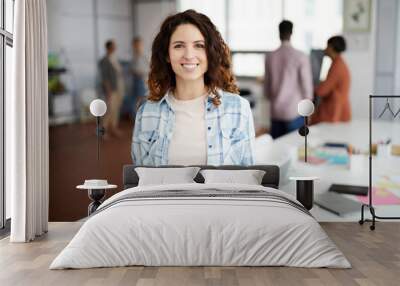 waist up portrait of contemporary woman posing at workplace and smiling at camera, copy space Wall mural