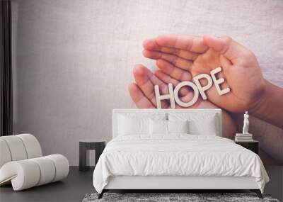 HOPE wooden word on praying hands , gratitude, faith concept Wall mural