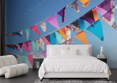 Summer festive colorful bunting and blue sky Wall mural