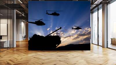 military tank and helicopters silhouetted against dawn or dusk blue sky Wall mural