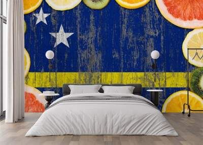 Curacao food concept. Fresh fruits from traditional gardens. Cooking concept on wooden flag background. Wall mural