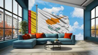 Guinea and Cyprus flag waving in the wind against white cloudy blue sky together. Diplomacy concept, international relations. Wall mural