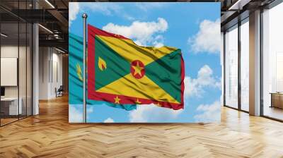 Kazakhstan and Grenada flag waving in the wind against white cloudy blue sky together. Diplomacy concept, international relations. Wall mural