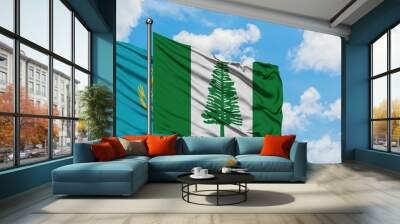 Kazakhstan and Norfolk Island flag waving in the wind against white cloudy blue sky together. Diplomacy concept, international relations. Wall mural