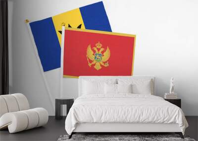 Montenegro and Barbados stick flags on white background. High quality fabric, miniature national flag. Peaceful global concept.White floor for copy space. Wall mural