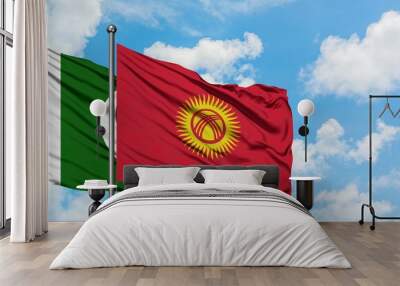 Pakistan and Kyrgyzstan flag waving in the wind against white cloudy blue sky together. Diplomacy concept, international relations. Wall mural