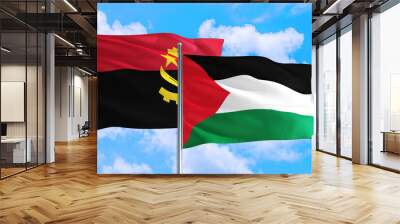 Palestine and Angola national flag waving in the windy deep blue sky. Diplomacy and international relations concept. Wall mural