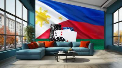 Philippines casino theme. Two ace in poker game, cards and black chips on green table with national flag background. Gambling and betting. Wall mural