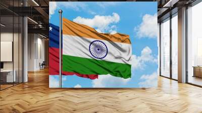 Samoa and India flag waving in the wind against white cloudy blue sky together. Diplomacy concept, international relations. Wall mural