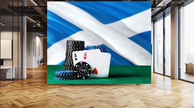 Scotland casino theme. Two ace in poker game, cards and black chips on green table with national flag background. Gambling and betting. Wall mural