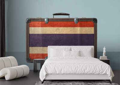 Thailand flag on old vintage leather suitcase with national concept. Retro brown luggage with copy space text. Wall mural